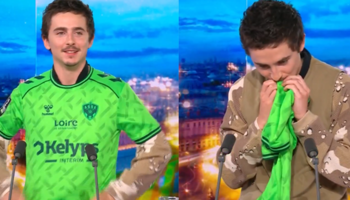 Timothée Chalamet beija escudo do Saint-Étienne durante programa — Foto: Timothé