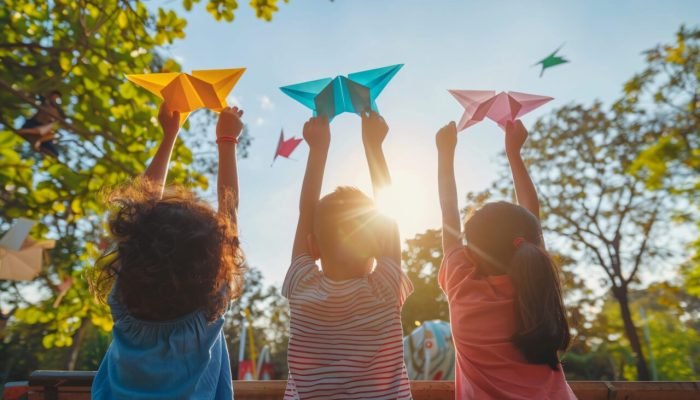 kid-playing-with-paper-plane-scaled-1