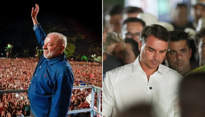 Lula acenando para multidão e Flávio Bolsonaro com semblante sério.