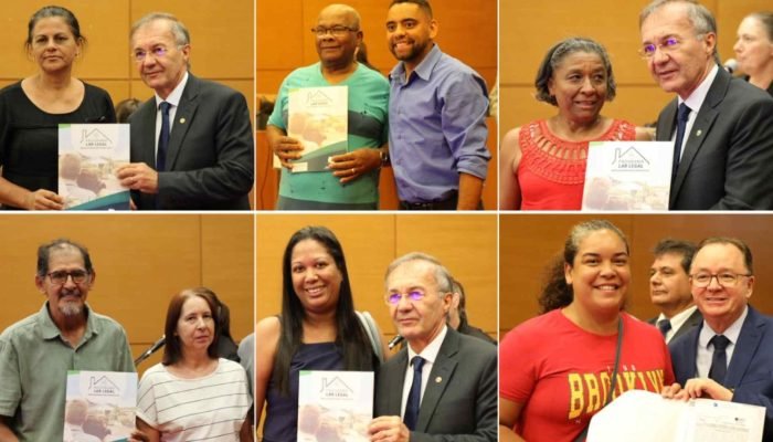 Famílias recebendo títulos imobiliários. (Reprodução, TJMS) — Foto: Famílias rec